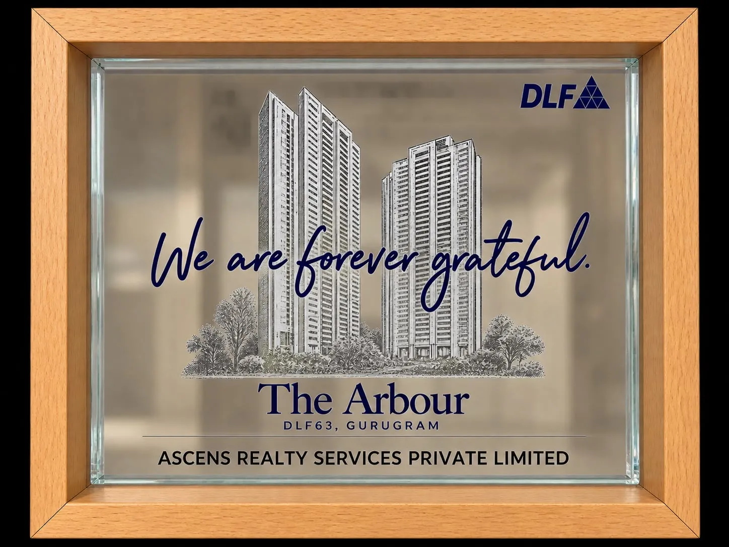 Etched glass DLF plaque for The Arbour, DLF63 Gurugram, inscribed to Ascens Realty Services Private Limited.